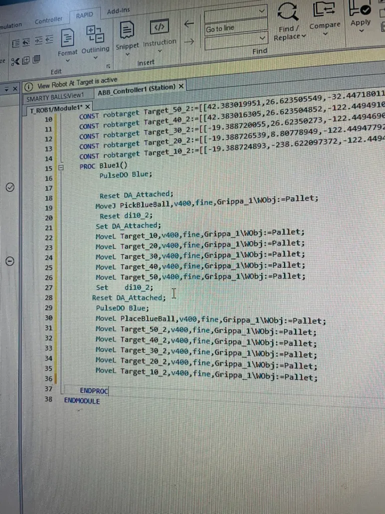 Photo of a computer screen showing an early version of the Blue1 RAPID routine open in the ABB RobotStudio editor.